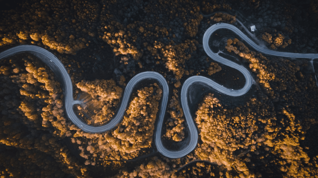 The Means Justify The End Winding Road in Mountains by Guney Ozgur (free use via Canva)